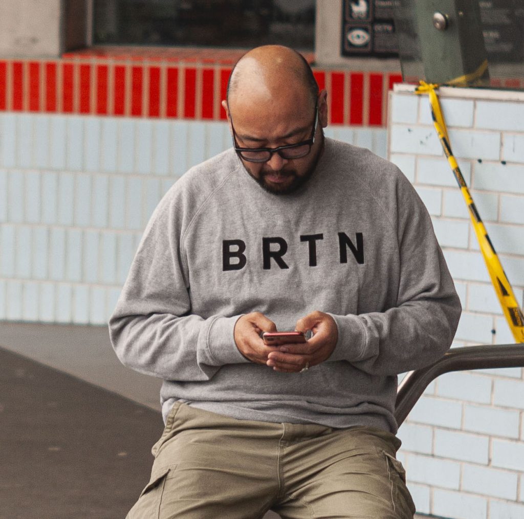 guy on his phone texting